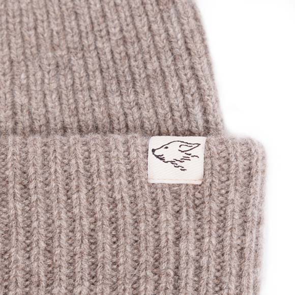 Mütze aus Yakwolle, Detail Logo